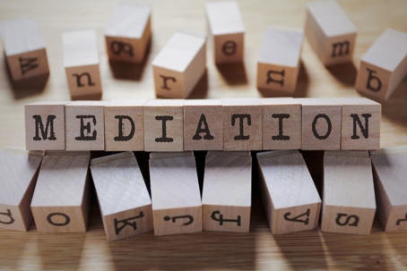 wooden blocks with black letters spelling out "mediation"